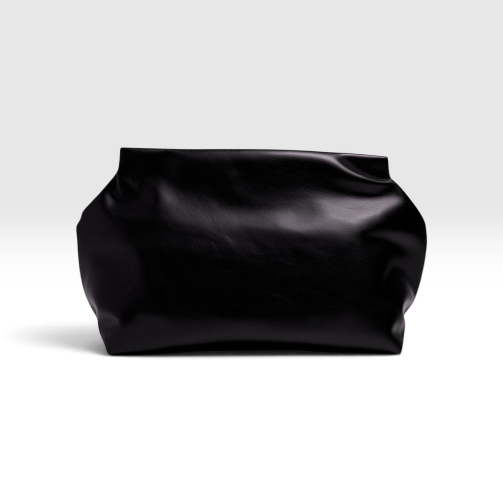Pochette nera CORI.MY DREAM PLAN DO! in morbida pelle dal design scultoreo ed essenziale per outfit eleganti